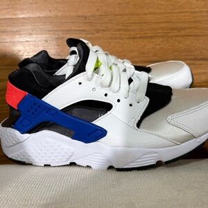 Nike Kids White and Black Sneakers with Blue and Red Accents